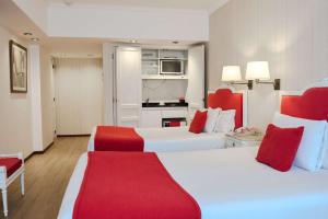 Postel nebo postele na pokoji v ubytování Ramada by Wyndham Buenos Aires Centro