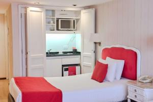 Postel nebo postele na pokoji v ubytování Ramada by Wyndham Buenos Aires Centro