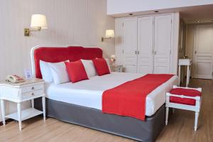 Postel nebo postele na pokoji v ubytování Ramada by Wyndham Buenos Aires Centro