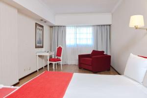 Postel nebo postele na pokoji v ubytování Ramada by Wyndham Buenos Aires Centro