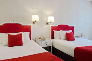 Postel nebo postele na pokoji v ubytování Ramada by Wyndham Buenos Aires Centro