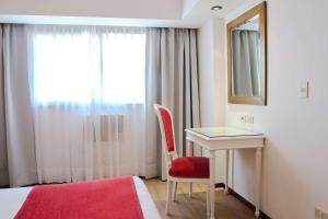 Postel nebo postele na pokoji v ubytování Ramada by Wyndham Buenos Aires Centro