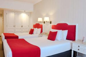 Postel nebo postele na pokoji v ubytování Ramada by Wyndham Buenos Aires Centro