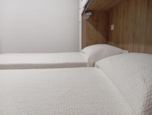 Postel nebo postele na pokoji v ubytování B&B Guesthouse La Casetta Di Sutri sulla Francigena