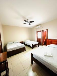 Postel nebo postele na pokoji v ubytování Hostal Luxuria Place