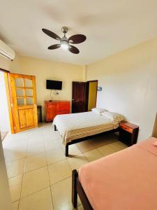 Postel nebo postele na pokoji v ubytování Hostal Luxuria Place