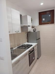 Kuchyň nebo kuchyňský kout v ubytování B&B Guesthouse La Casetta Di Sutri sulla Francigena