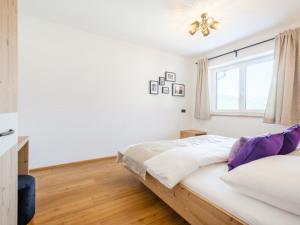 Łóżko lub łóżka w pokoju w obiekcie Roßbrand und Tauern-Blick