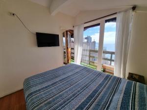 Postel nebo postele na pokoji v ubytování Al Mar Cabañas