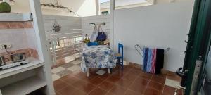 a small room with a table in a kitchen at MAREE SOL RESIDENCE Camere e Appartamenti in Torre San Giovanni Ugento +103 photos