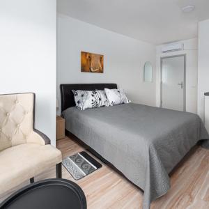 Postel nebo postele na pokoji v ubytování Fenix Apartments + 23 fotografií