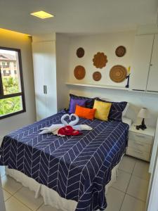 a bedroom with a bed with towels on it at Vg Sun Cumbuco C1407 Studium in Cumbuco