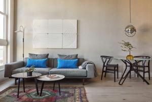 a living room with a couch and a table at Archway Hotel Residence in Philadelphia