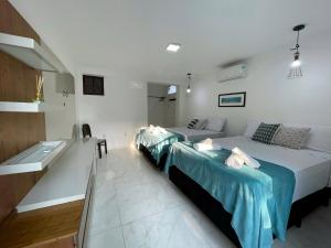 Postel nebo postele na pokoji v ubytování Do Adriano Suites + 28 fotografií