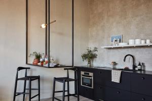 Kuchyň nebo kuchyňský kout v ubytování Archway Hotel Residence + 8 fotografií