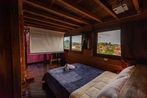 Postel nebo postele na pokoji v ubytování Hotel Spa Bliss Guatape + 37 fotografií