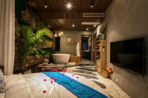 TV a/nebo společenská místnost v ubytování Bed and Breakfast B&B Qianxi 浅喜 SanYa