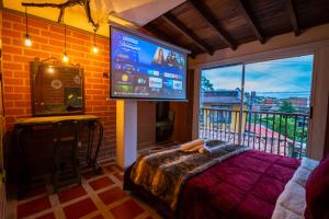 TV a/nebo společenská místnost v ubytování Hotel Spa Bliss Guatape