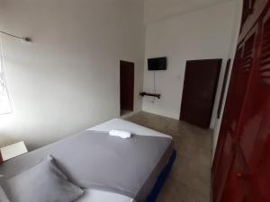 Postel nebo postele na pokoji v ubytování Hostal Tamara