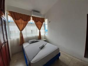 Postel nebo postele na pokoji v ubytování Hostal Tamara