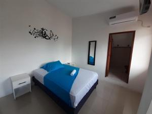 Postel nebo postele na pokoji v ubytování Hostal Tamara