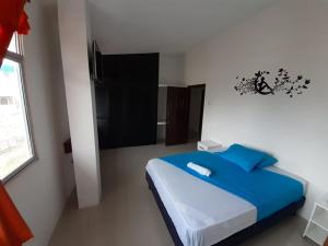 Postel nebo postele na pokoji v ubytování Hostal Tamara