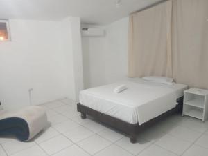Postel nebo postele na pokoji v ubytování Hostal Tamara