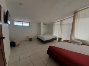 Postel nebo postele na pokoji v ubytování Hostal Tamara + 12 fotografií