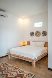 Postel nebo postele na pokoji v ubytování Gajahmina Guesthouse