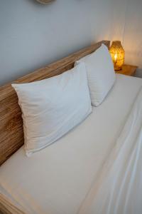 Postel nebo postele na pokoji v ubytování Gajahmina Guesthouse