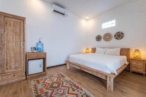Postel nebo postele na pokoji v ubytování Gajahmina Guesthouse