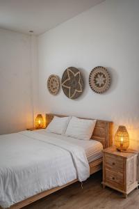 Postel nebo postele na pokoji v ubytování Gajahmina Guesthouse