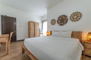 Postel nebo postele na pokoji v ubytování Gajahmina Guesthouse