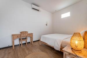 Postel nebo postele na pokoji v ubytování Gajahmina Guesthouse