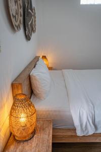 Postel nebo postele na pokoji v ubytování Gajahmina Guesthouse