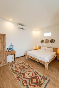 Postel nebo postele na pokoji v ubytování Gajahmina Guesthouse