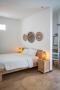 Postel nebo postele na pokoji v ubytování Gajahmina Guesthouse
