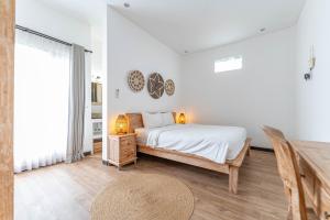 Postel nebo postele na pokoji v ubytování Gajahmina Guesthouse