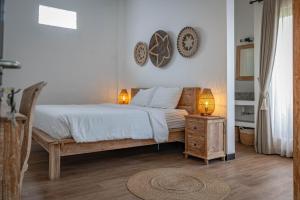 Postel nebo postele na pokoji v ubytování Gajahmina Guesthouse