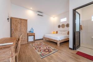 Postel nebo postele na pokoji v ubytování Gajahmina Guesthouse