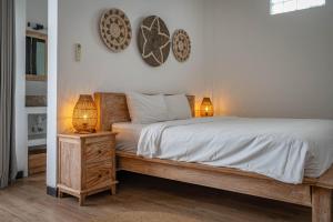 Postel nebo postele na pokoji v ubytování Gajahmina Guesthouse