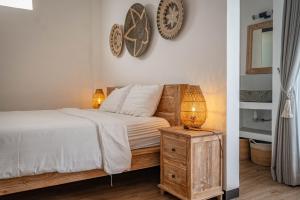 Postel nebo postele na pokoji v ubytování Gajahmina Guesthouse