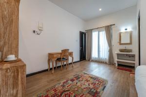 Postel nebo postele na pokoji v ubytování Gajahmina Guesthouse