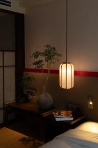 Postel nebo postele na pokoji v ubytování Suzu Saigon - A Boutique Hotel