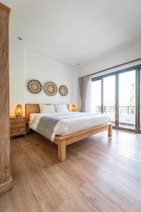 Postel nebo postele na pokoji v ubytování Gajahmina Guesthouse