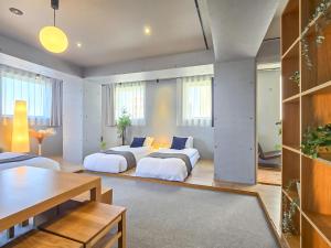 Postel nebo postele na pokoji v ubytování STAY ARI Apartment Hotel Shinjuku-Takadanobaba + 37 fotografií