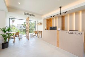 a kitchen and dining area with a counter with araxico sign on it at Sagredo Boutique Hotel & Spa in Ágios Fokás