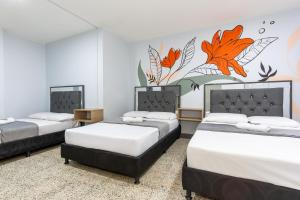 Postel nebo postele na pokoji v ubytování Hotel Guayacanes 70