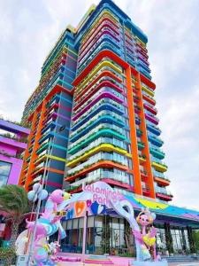a large building with a rainbow colored building at Flamingo Hai Tien in Hoằng Hóa