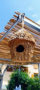 a straw bird house with a hole in it at Il nido in Marina di Massa